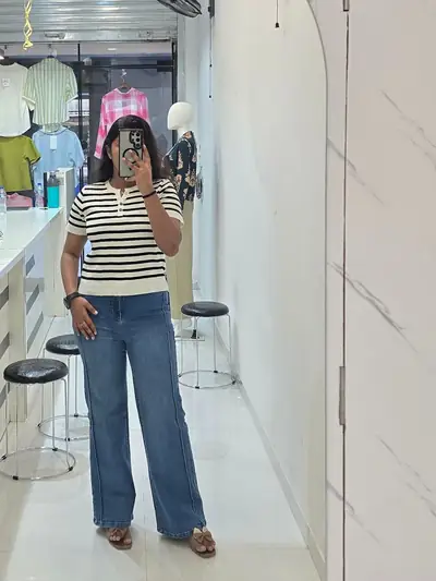 Striped top with wide-leg jeans, photographed as a mirror selfie at Selfie Western Wear